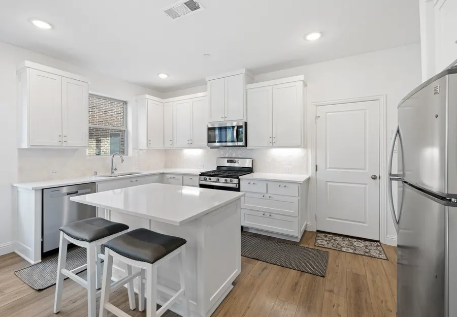 Kitchen open to the dining area at 4335 Fall Blossom Dr