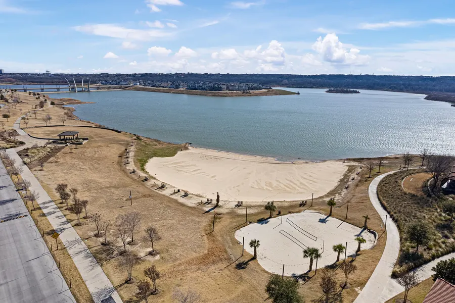 Aerial view of Viridian's sand beach, lake shoreline, and beach volleyball court