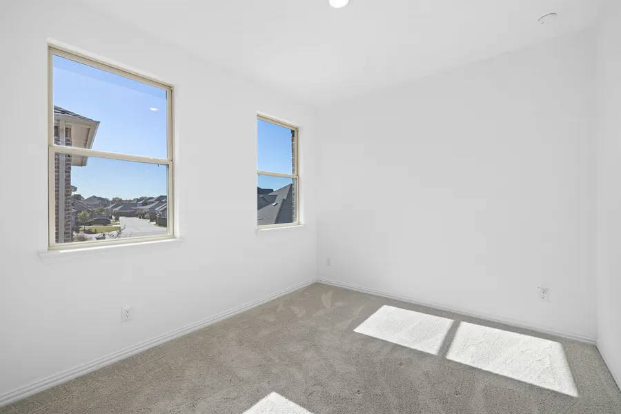 Secondary bedroom with carpet and a closet at 4335 Fall Blossom Dr