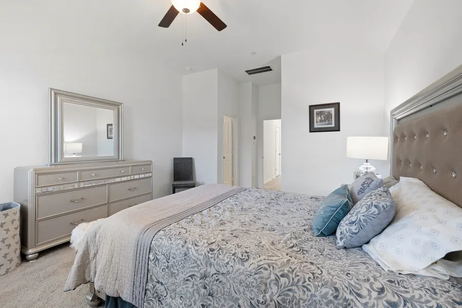 Primary bedroom with a mirrored dresser at 4335 Fall Blossom Dr