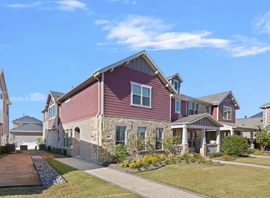 Townhomes along a tree-lined street in Viridian Village