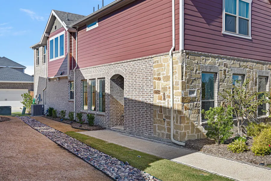Stone and siding townhome exteriors in Viridian Village