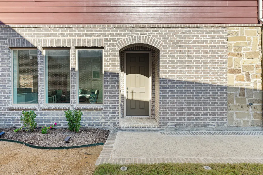 Exterior stone and brick entry detail at 4335 Fall Blossom Dr
