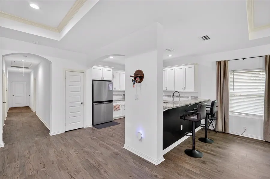 Hallway with a pantry and stainless refrigerator at 4552 Corregidor St