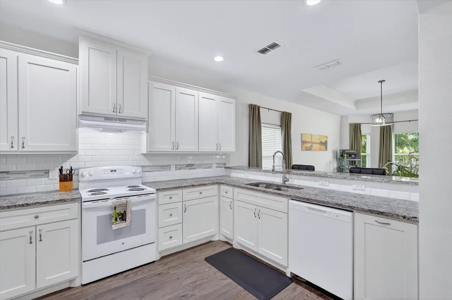 Kitchen range and granite counters at 4552 Corregidor St