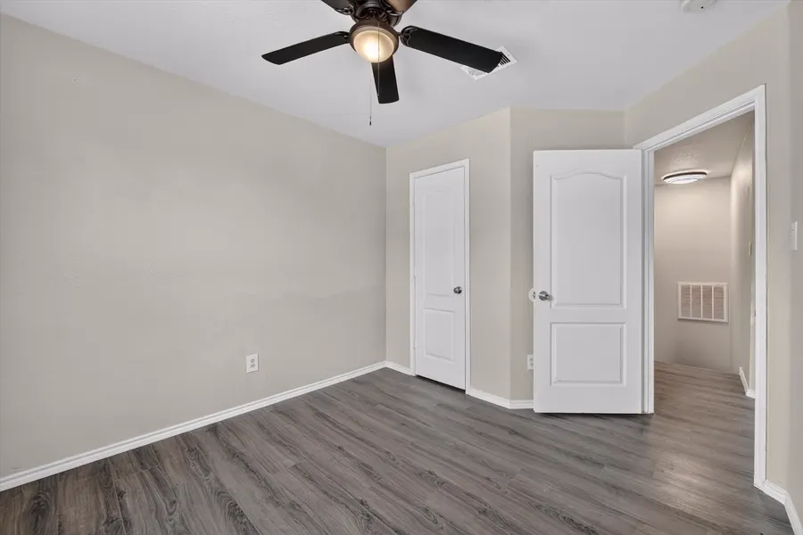 Bedroom with double closet doors opening to the hall at 716 River Hill Ln