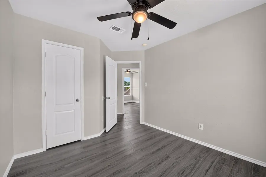 Bedroom with a closet and a doorway through to the next bedroom at 716 River Hill Ln