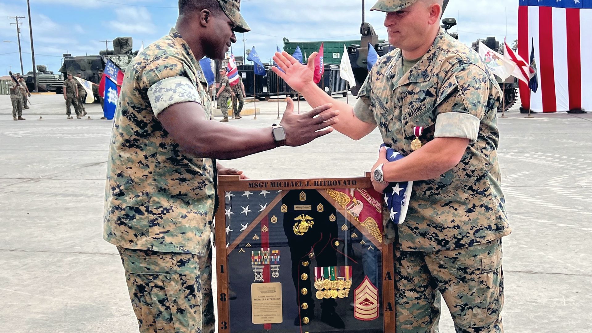 Mike Ritrovato at his United States Marine Corps retirement ceremony, receiving a shadow box engraved MSGT Michael J. Ritrovato